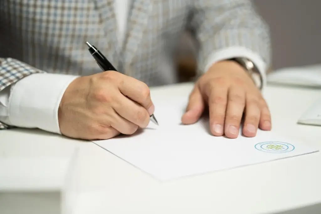 Reviewing a car shipping contract on a clipboard